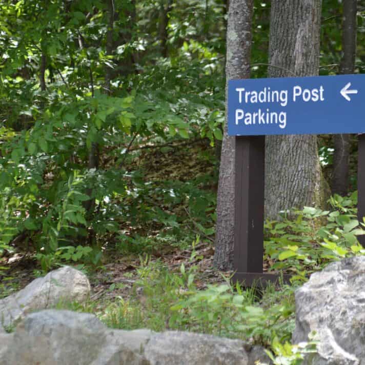 Parking sign in the woods.