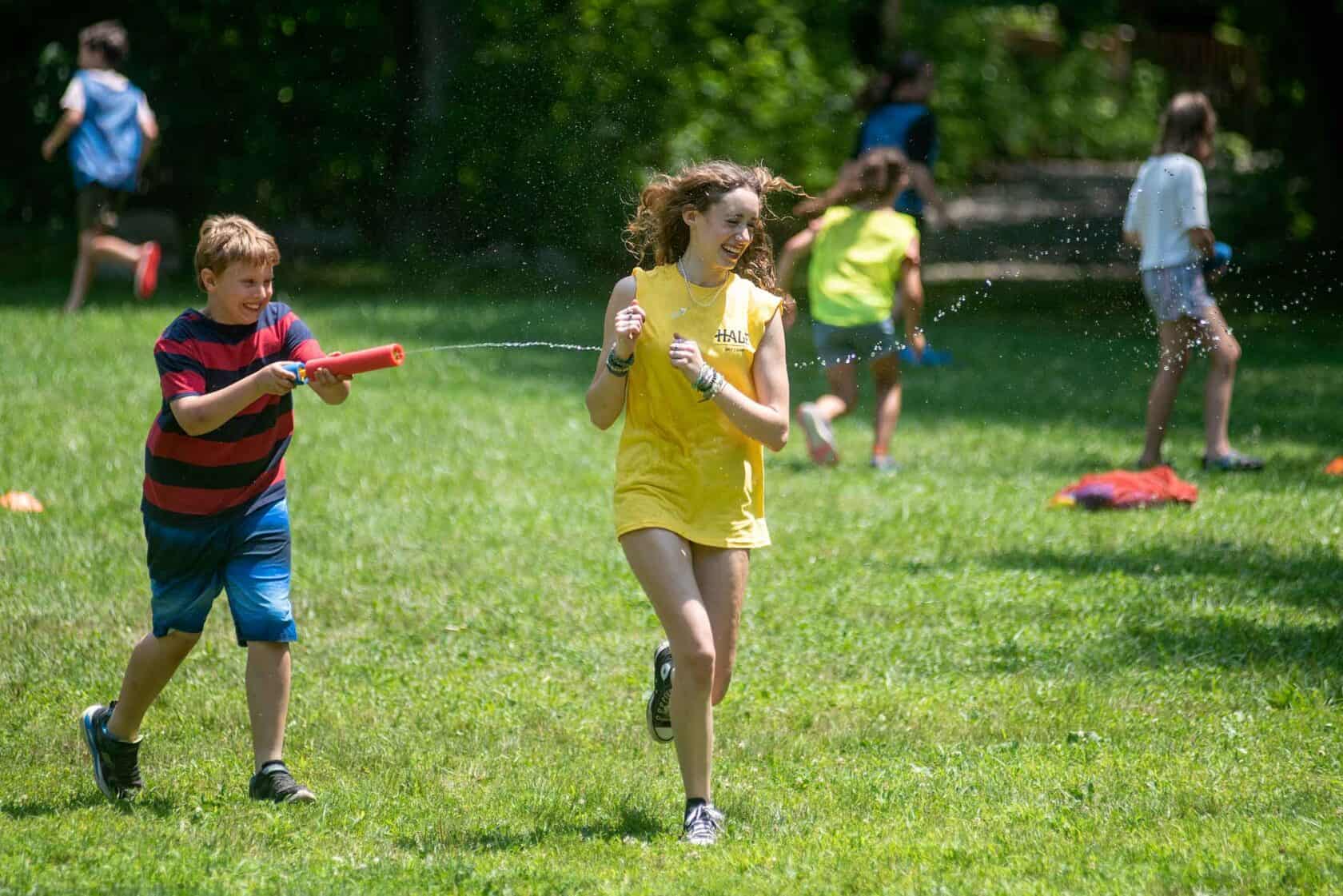 Campers having a water fight.