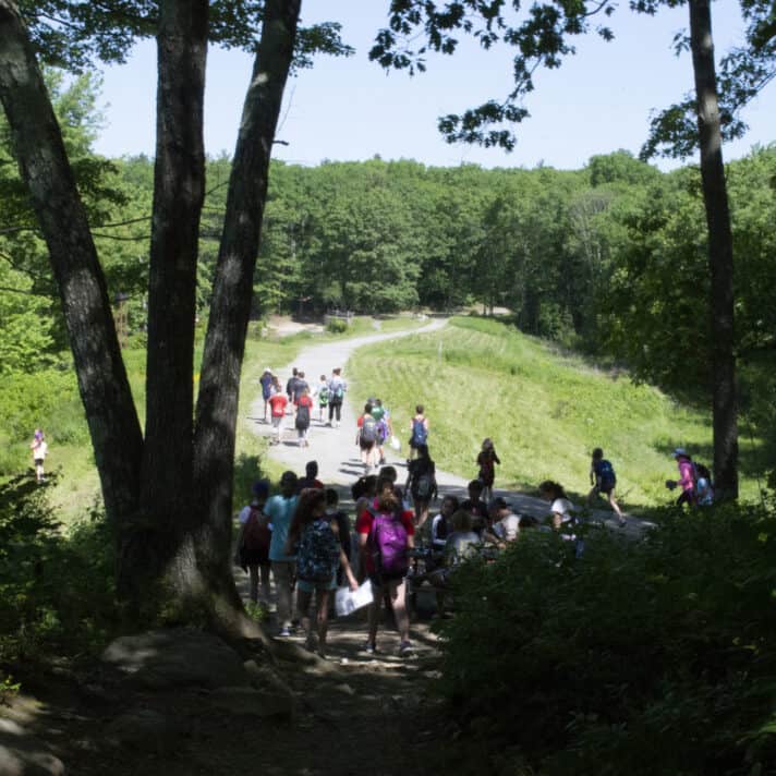 Students hike together on a trail.