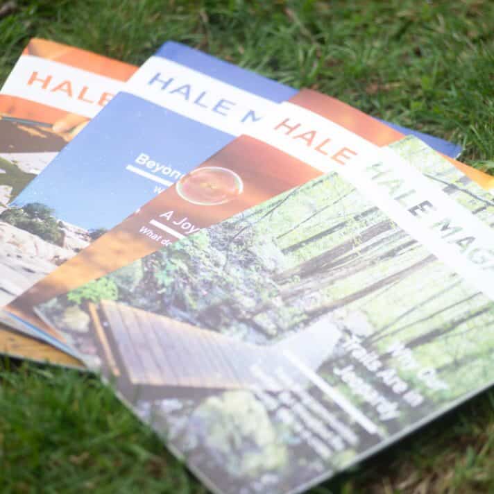 Hale magazines laid out on the grass.