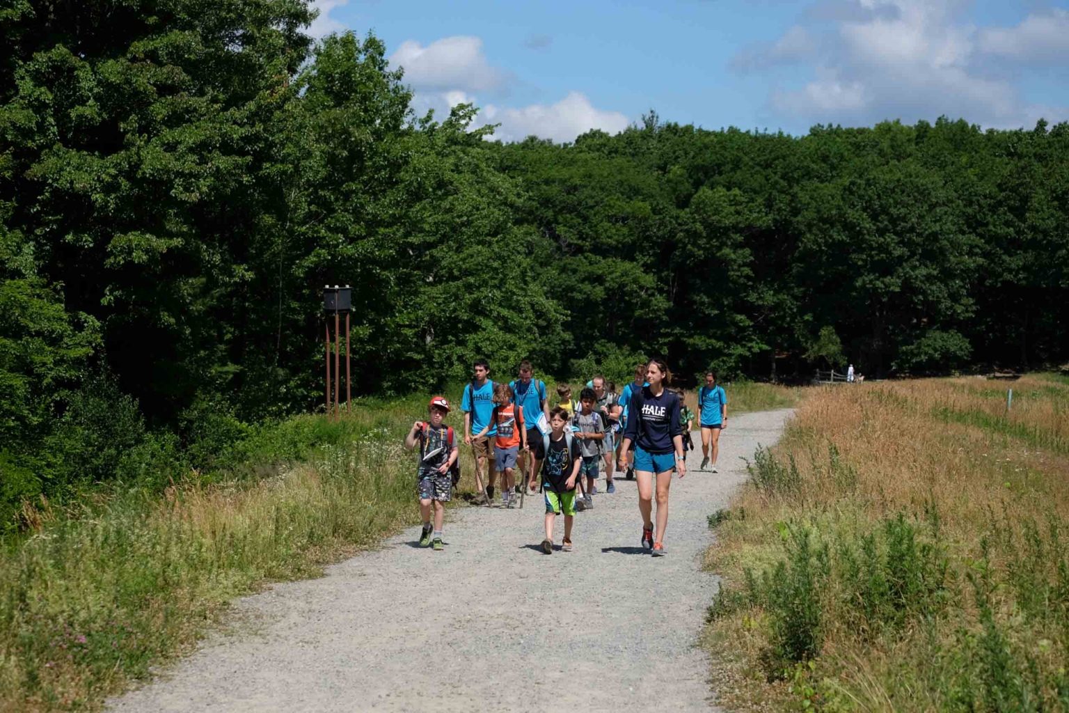 Campers walking down a path.