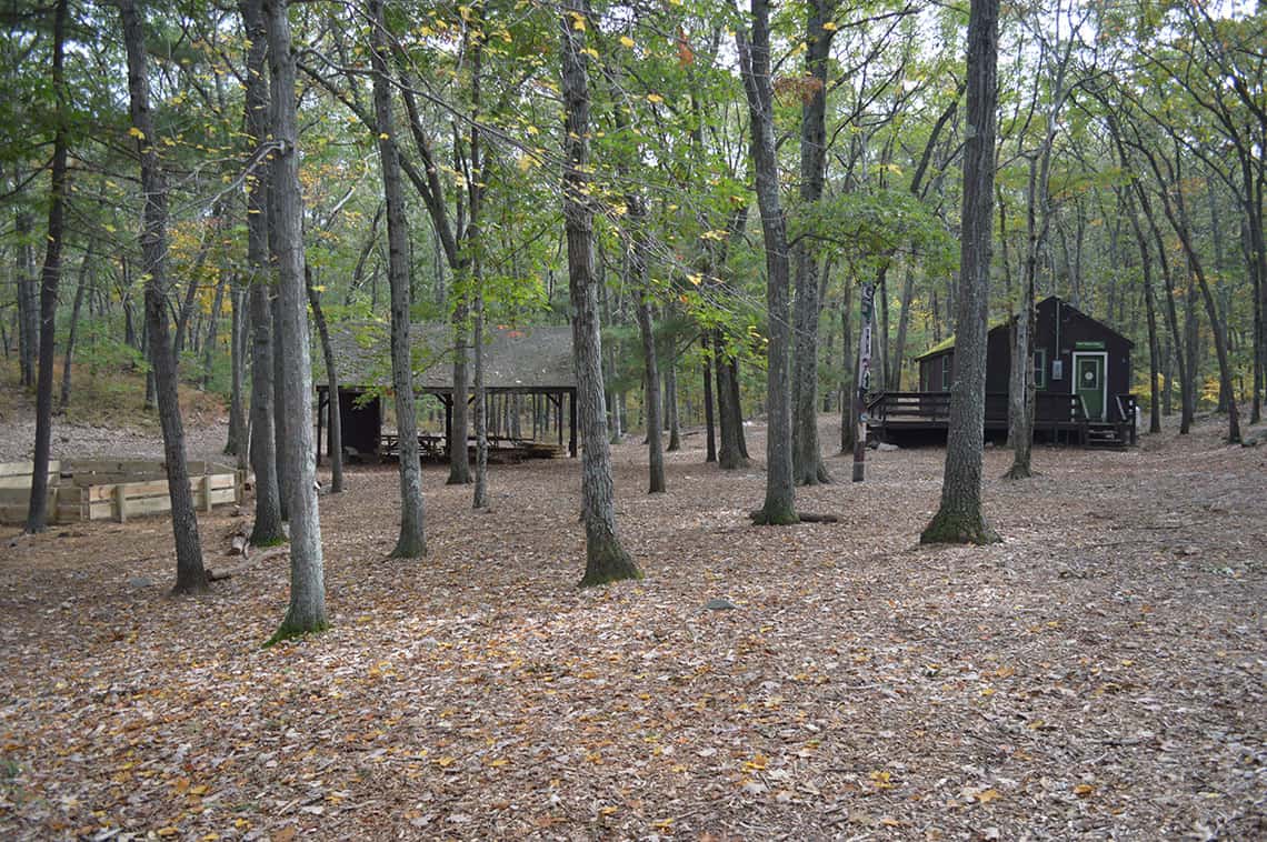 Wooded area with cabins.