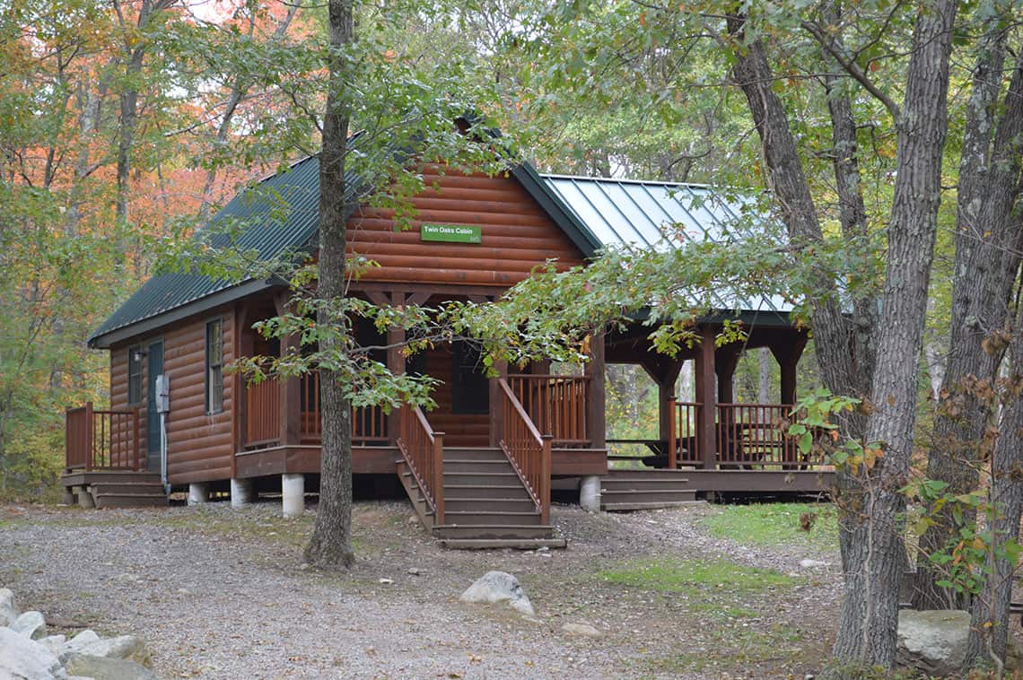 Orange cabin in the woods.