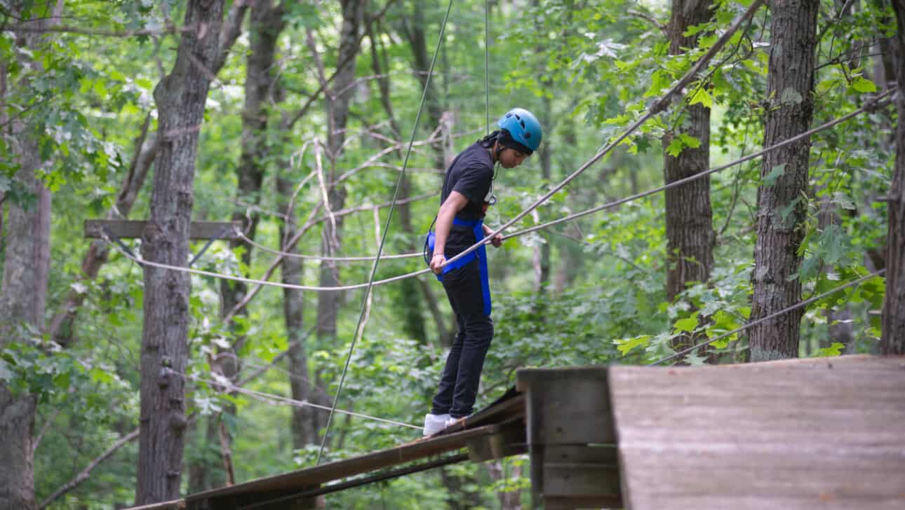 Student walking the challenge course.