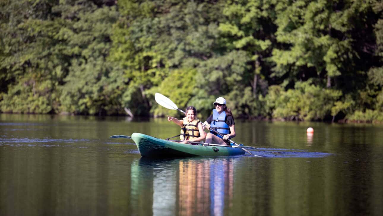 Mother and daughter kayaking.