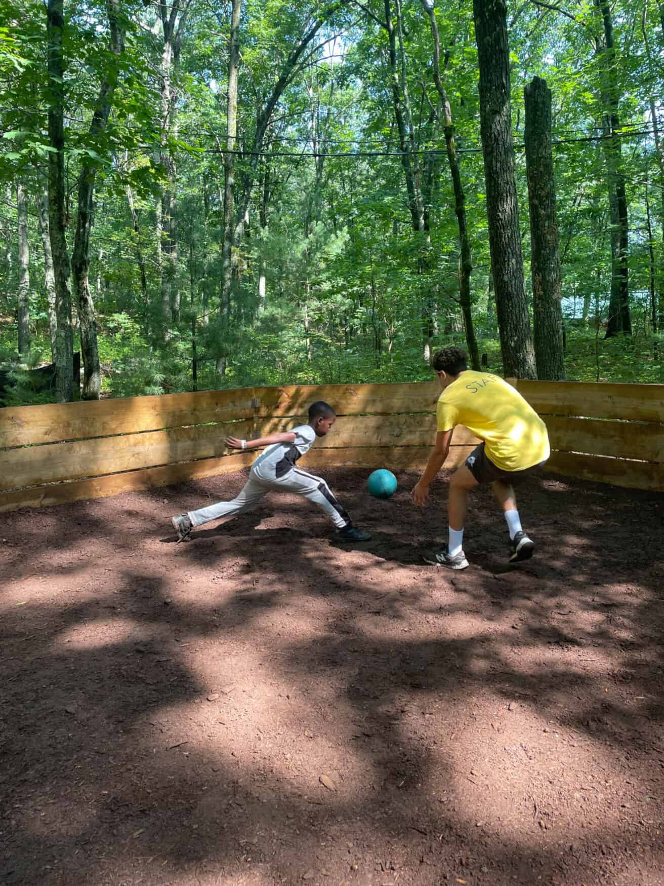 Counselor playing a game with a camper.