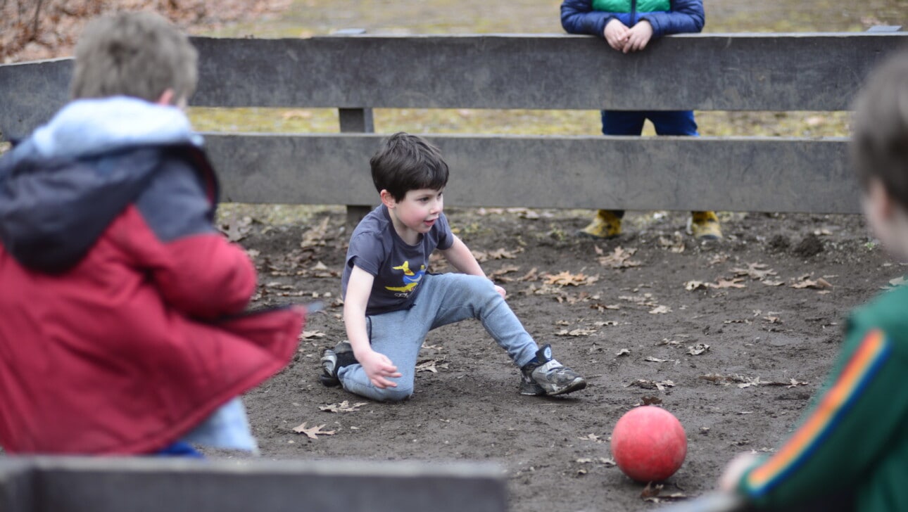 Kids get muddy while they play Gaga ball in the spring